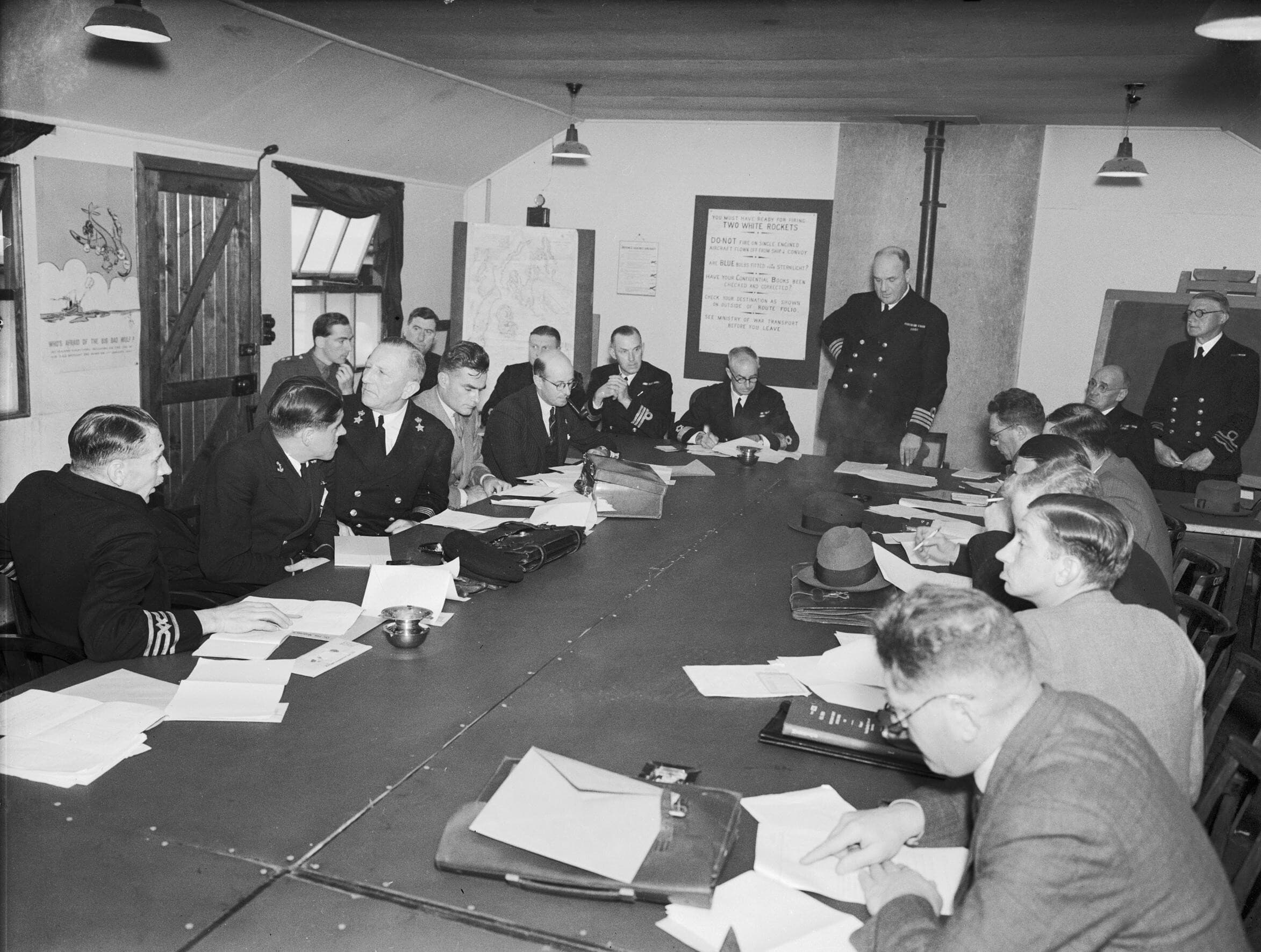 A convoy conference in progress, August 1942 - masters and naval officers planning the crossing
